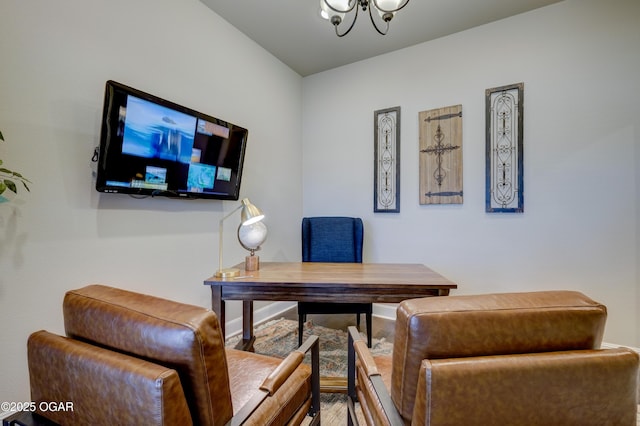 office with wood finished floors and a chandelier