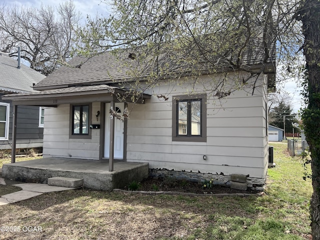 119 W Park St, Pittsburg, KS 66762 - view of front of house with a shingled roof and covered porch