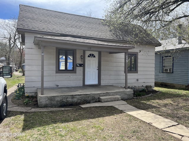 119 W Park St, Pittsburg, KS 66762 - bungalow-style home featuring roof with shingles and a porch
