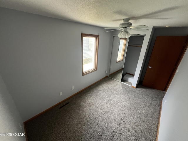 119 W Park St, Pittsburg, KS 66762 - unfurnished bedroom with a closet, baseboards, a textured ceiling, carpet flooring, and ceiling fan