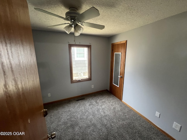 119 W Park St, Pittsburg, KS 66762 - carpeted spare room featuring ceiling fan, baseboards, and a textured ceiling