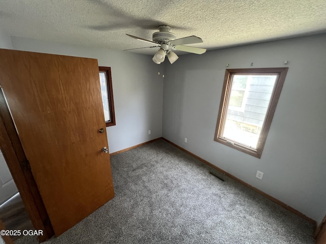 119 W Park St, Pittsburg, KS 66762 - unfurnished room with plenty of natural light, carpet floors, ceiling fan, and visible vents