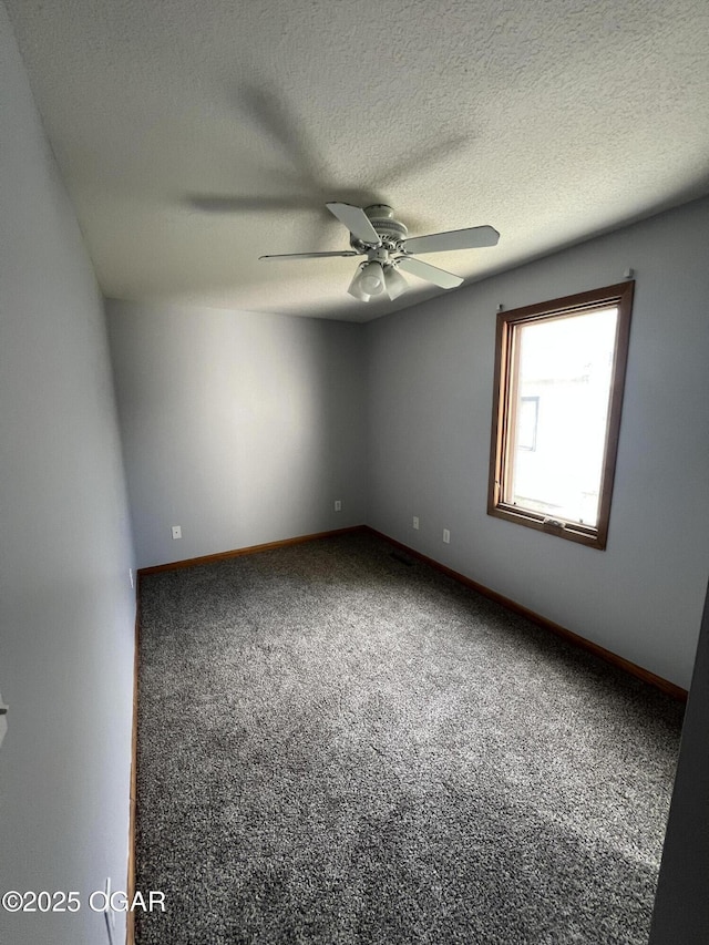119 W Park St, Pittsburg, KS 66762 - carpeted spare room with a textured ceiling, baseboards, and ceiling fan