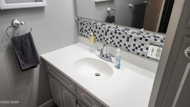 bathroom with backsplash and vanity