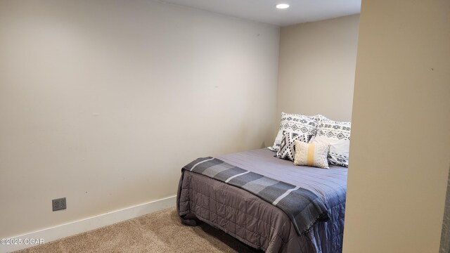 bedroom with carpet and baseboards