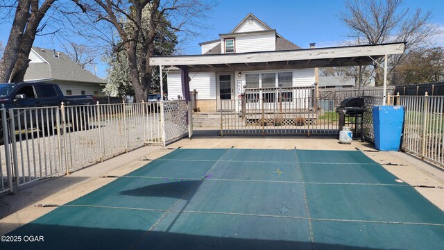 view of front of property with roof with shingles and fence