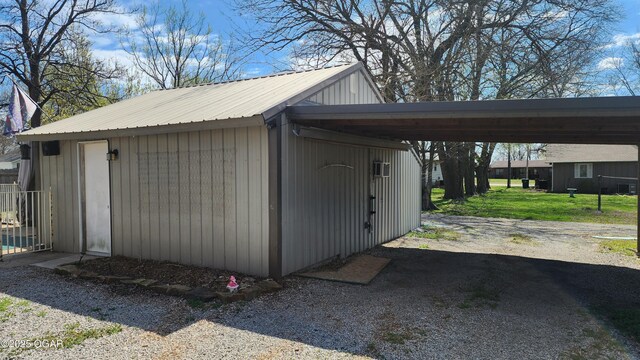 view of outbuilding featuring a carport