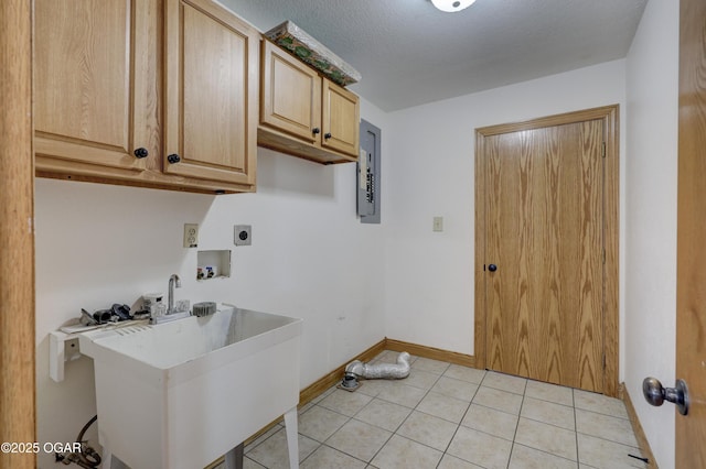 24600 State Highway 96, Webb City, MO 64870 - washroom featuring washer hookup, hookup for an electric dryer, a sink, baseboards, and cabinet space