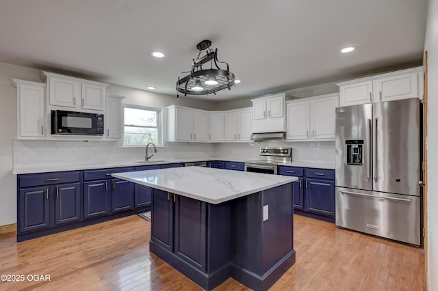 24600 State Highway 96, Webb City, MO 64870 - kitchen featuring a sink, blue cabinetry, white cabinetry, and appliances with stainless steel finishes