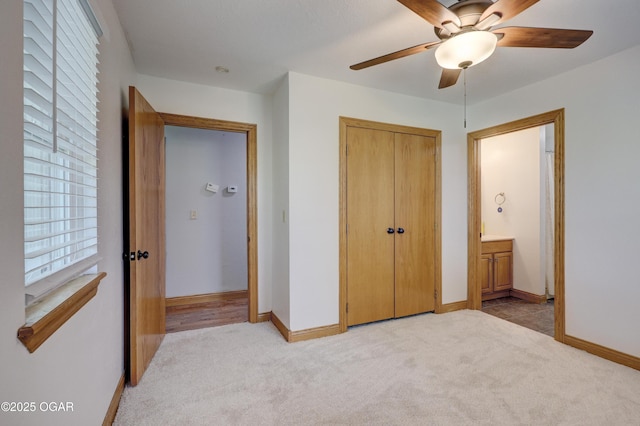 24600 State Highway 96, Webb City, MO 64870 - unfurnished bedroom featuring a closet, light colored carpet, and baseboards