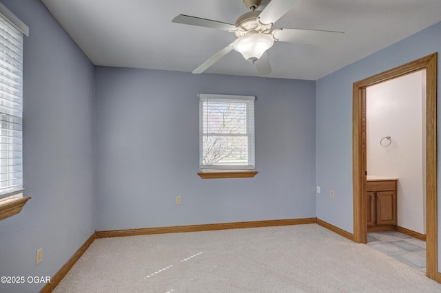 24600 State Highway 96, Webb City, MO 64870 - spare room featuring light colored carpet, baseboards, and ceiling fan