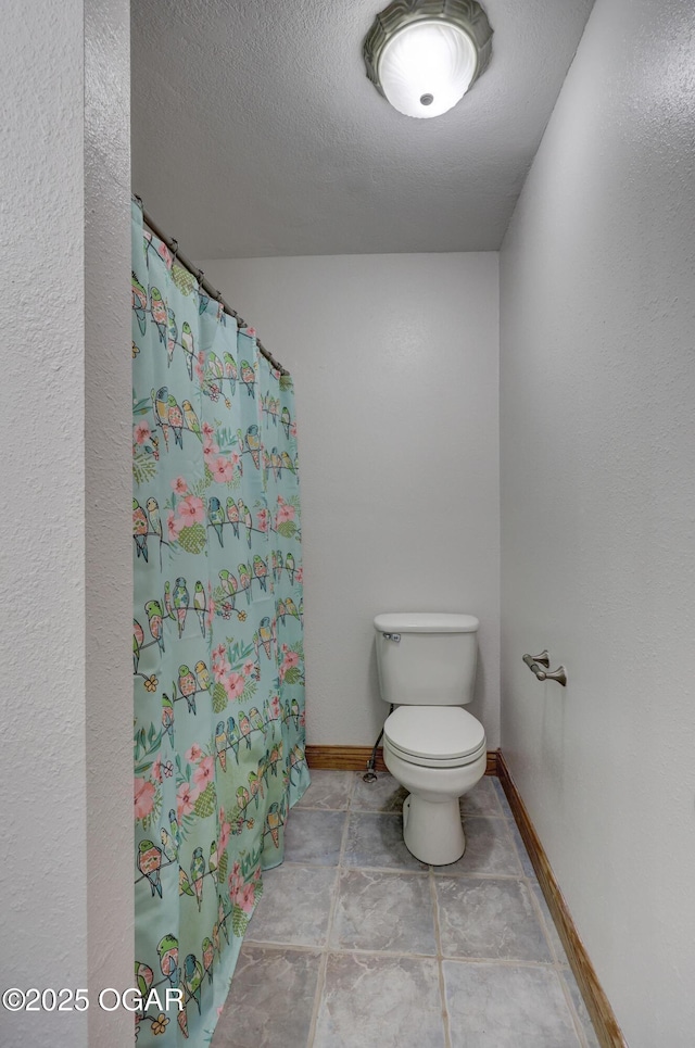 24600 State Highway 96, Webb City, MO 64870 - bathroom featuring a shower with shower curtain, baseboards, and toilet