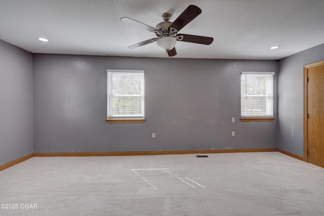 24600 State Highway 96, Webb City, MO 64870 - carpeted spare room with ceiling fan, visible vents, baseboards, and a healthy amount of sunlight