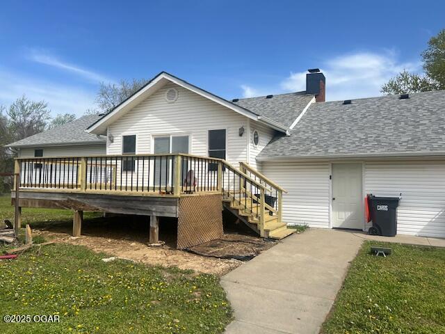 24600 State Highway 96, Webb City, MO 64870 - back of property with a chimney, a shingled roof, and a deck