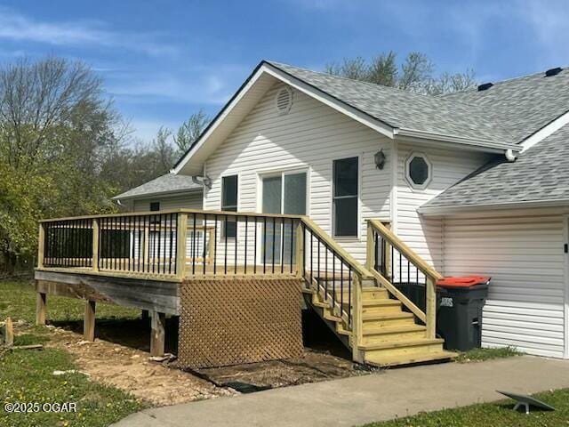 24600 State Highway 96, Webb City, MO 64870 - back of property with a deck and roof with shingles