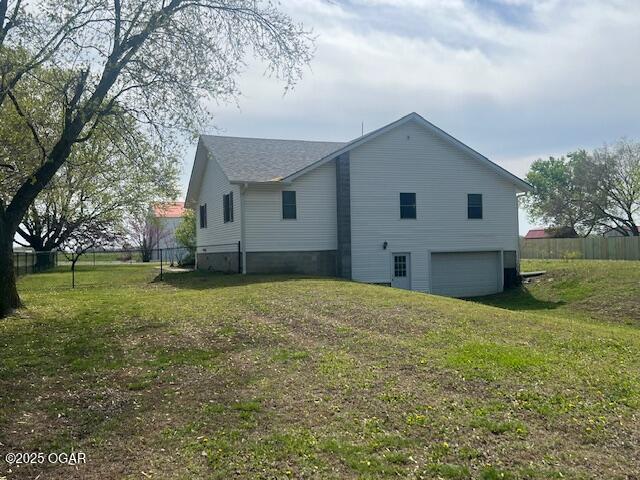 24600 State Highway 96, Webb City, MO 64870 - view of side of property featuring a yard, fence, and a garage