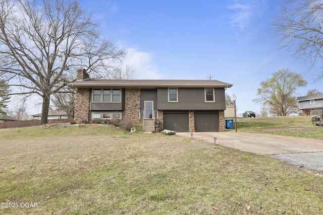 122 Valley View Dr, Joplin, MO 64804 - split foyer home featuring driveway, a front yard, a chimney, brick siding, and a garage