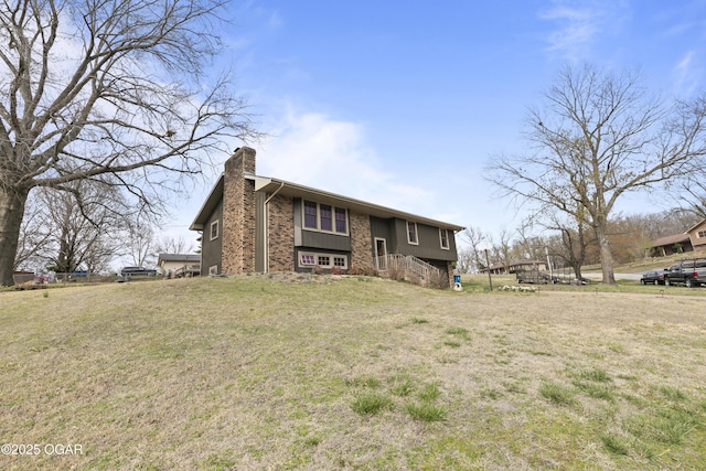 122 Valley View Dr, Joplin, MO 64804 - bi-level home featuring a chimney and a front yard