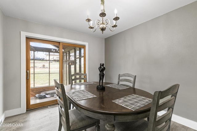 122 Valley View Dr, Joplin, MO 64804 - dining room featuring baseboards, a chandelier, and light wood finished floors