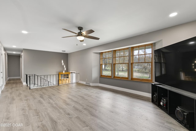 122 Valley View Dr, Joplin, MO 64804 - unfurnished living room featuring wood finished floors, recessed lighting, baseboards, and ceiling fan