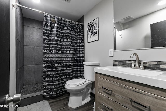 122 Valley View Dr, Joplin, MO 64804 - bathroom with a shower with shower curtain, toilet, vanity, wood finished floors, and visible vents