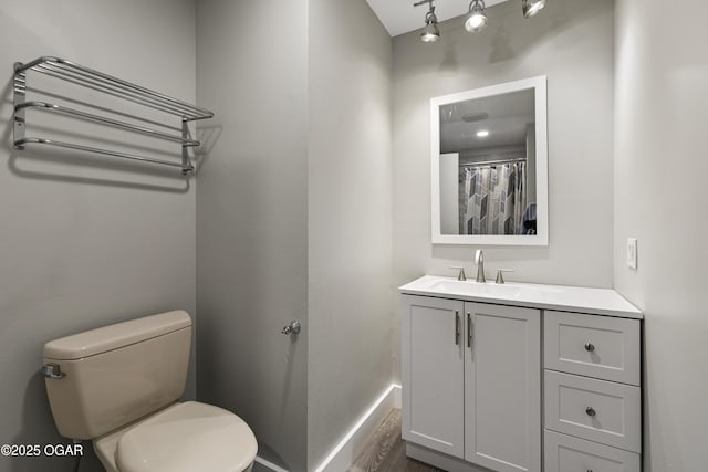 122 Valley View Dr, Joplin, MO 64804 - bathroom featuring baseboards, toilet, and vanity