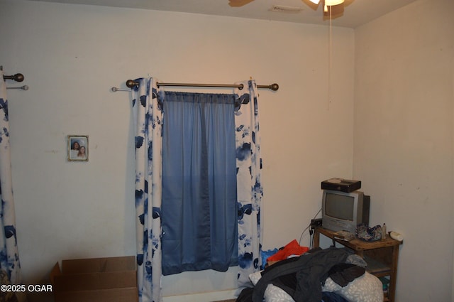 bathroom with visible vents, ceiling fan, and a shower with shower curtain