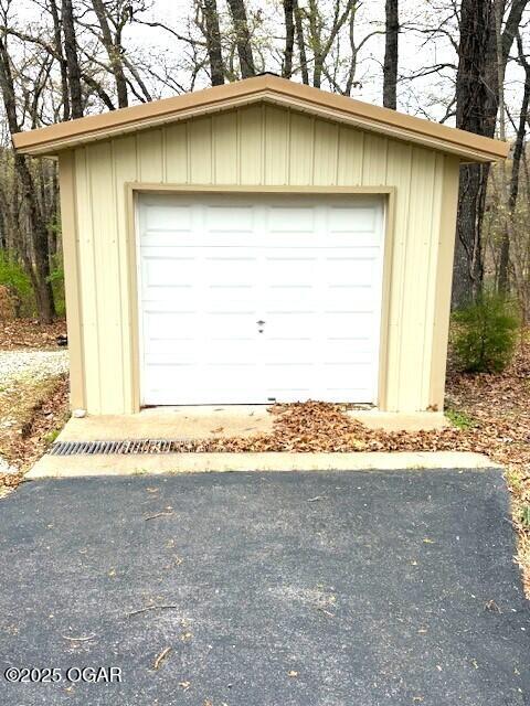 detached garage featuring driveway