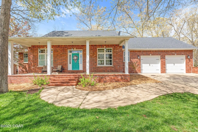 view of front of house with brick siding, an attached garage, covered porch, and concrete driveway