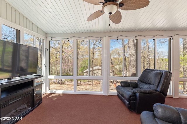 sunroom / solarium with carpet flooring and plenty of natural light
