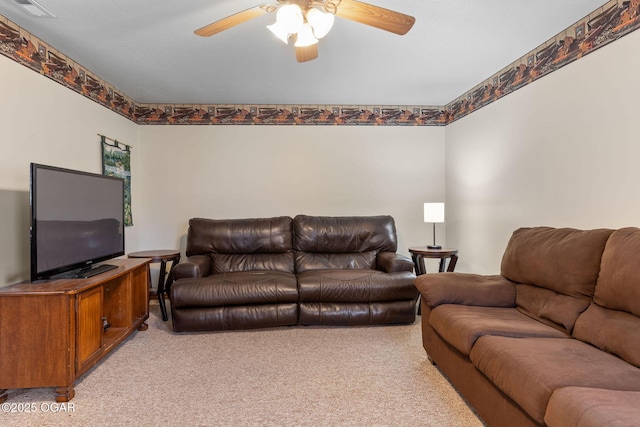 living area featuring visible vents, light colored carpet, and ceiling fan