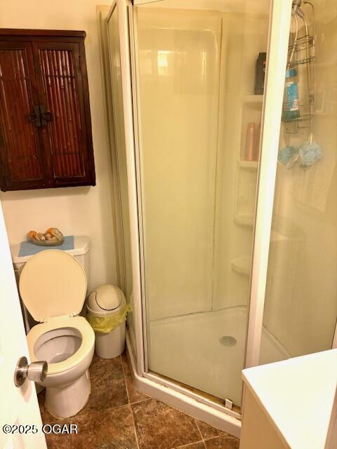 1530 S Oronogo St, Webb City, MO 64870 - full bath with a stall shower, toilet, tile patterned floors, and vanity