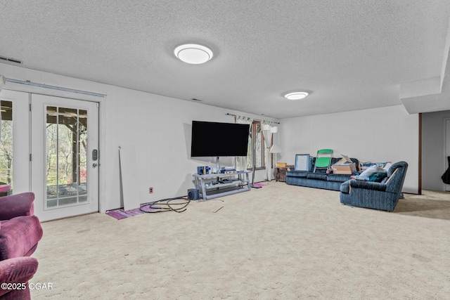 4427 Edgewood Cir, Loma Linda, MO 64804 - living room with a textured ceiling, carpet flooring, and visible vents