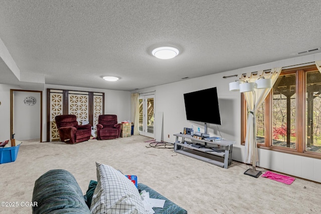 4427 Edgewood Cir, Loma Linda, MO 64804 - carpeted living area featuring visible vents and a textured ceiling