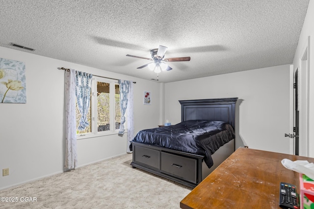 4427 Edgewood Cir, Loma Linda, MO 64804 - bedroom featuring visible vents, baseboards, a ceiling fan, carpet, and a textured ceiling
