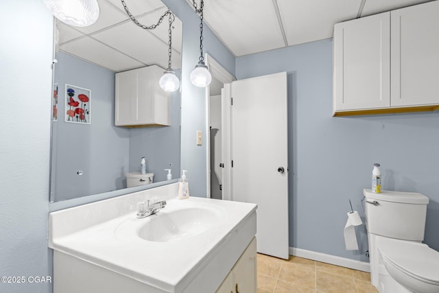 4427 Edgewood Cir, Loma Linda, MO 64804 - bathroom featuring tile patterned flooring, toilet, vanity, and baseboards