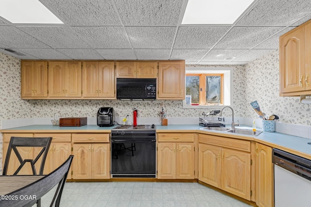 4427 Edgewood Cir, Loma Linda, MO 64804 - kitchen featuring light countertops, wallpapered walls, a sink, and black appliances