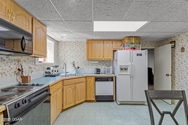 4427 Edgewood Cir, Loma Linda, MO 64804 - kitchen with a sink, light countertops, black appliances, wallpapered walls, and light floors