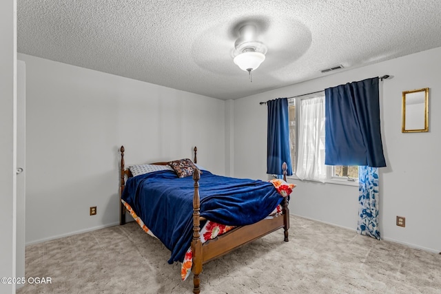4427 Edgewood Cir, Loma Linda, MO 64804 - carpeted bedroom featuring visible vents, baseboards, a ceiling fan, and a textured ceiling