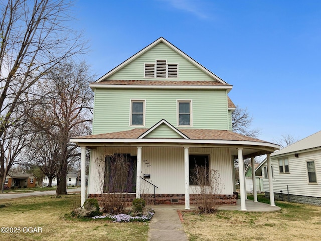 323 W Maple St, Columbus, KS 66725 - view of front of property featuring crawl space, a front lawn, a porch, and roof with shingles