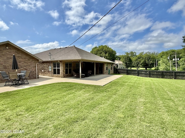 2035 Chickadee Dr, Webb City, MO 64870 - rear view of house featuring a patio area, brick siding, and roof with shingles