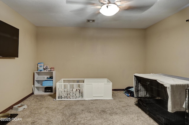 bedroom featuring baseboards, carpet floors, ceiling fan, and visible vents
