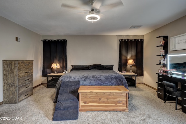 carpeted bedroom featuring baseboards, ceiling fan, and visible vents
