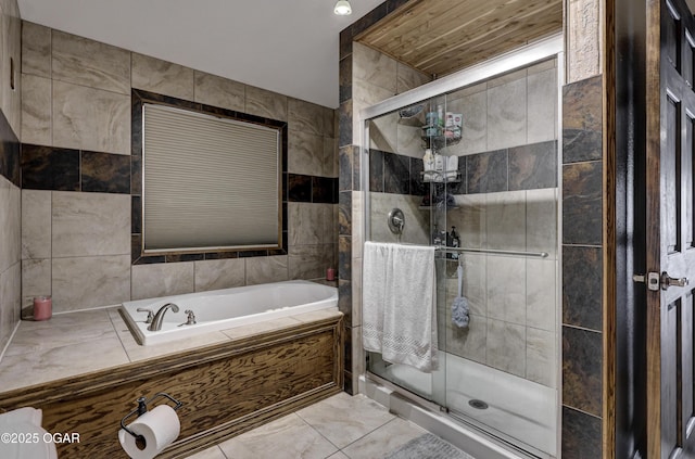 full bath with a stall shower, tile walls, marble finish floor, and a bath