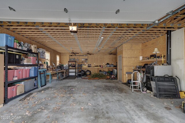 garage with a workshop area and a garage door opener