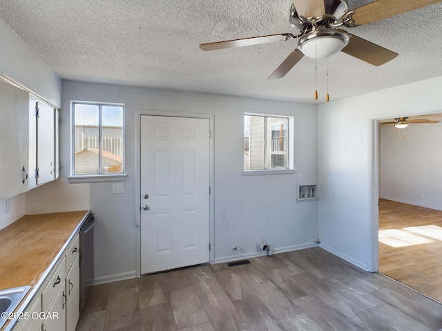 1515 S Missouri Ave, Joplin, MO 64804 - clothes washing area with wood finished floors, laundry area, visible vents, ceiling fan, and hookup for a washing machine
