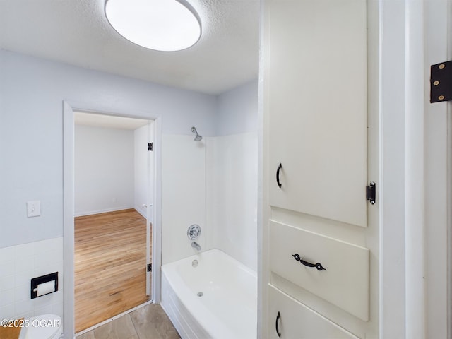 1515 S Missouri Ave, Joplin, MO 64804 - bathroom with wood finished floors and shower / bathtub combination