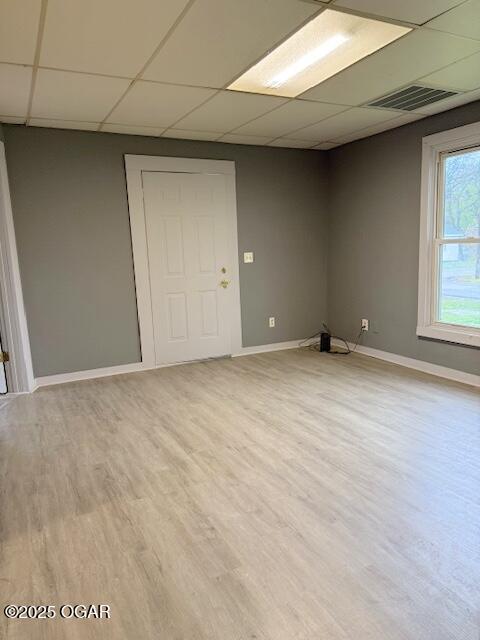 201 N Georgia St, Pittsburg, KS 66762 - spare room with a paneled ceiling, wood finished floors, and baseboards