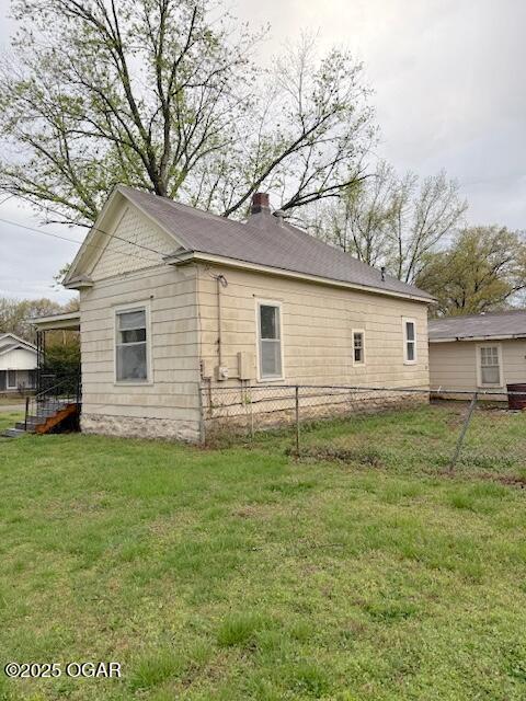 201 N Georgia St, Pittsburg, KS 66762 - view of property exterior featuring a chimney