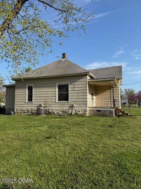201 N Georgia St, Pittsburg, KS 66762 - rear view of property with a chimney, a yard, and roof with shingles